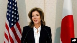 FILE - US Ambassador to Japan Caroline Kennedy gives a statement shortly after her arrival in Japan at the Narita International Airport in Narita, east of Tokyo, Friday, Nov. 15, 2013. 