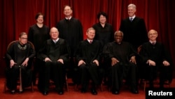 File -- U.S. Supreme Court justices, front row, from left, Ruth Bader Ginsburg, Anthony Kennedy, Chief Justice John Roberts, Clarence Thomas and Stephen Breyer; back row, from left, Elena Kagan, Samuel Alito, Sonia Sotomayor and Associate Justice Neil Gorsuch. (REUTERS/Jonathan Ernst)