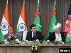 Afghanistan President Ashraf Ghani, right, Turkmenistan President Kurbanguly Berdymukhamedov, center, and India's Minister of State for External Affairs M.J. Akbar attend the inauguration ceremony of TAPI pipeline construction work, in Herat, Afghanistan.