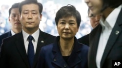 Ousted South Korean President Park Geun-hye arrives at the Seoul Central District Court for hearing on a prosecutors' request for her arrest for corruption, in Seoul, South Korea, March 30, 2017.