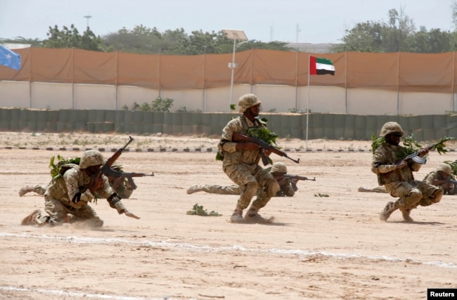 FILE - Members of the Somali military perform a defensive drill after attending a commando training exercise in Mogadishu, Jan. 20, 2016.