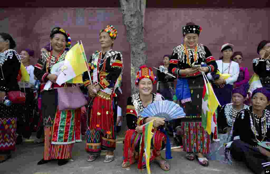 Ethnic Kachin Catholic devotees gather along a road to see Pope Francis in Yangon, Myanmar ahead of his arrival.