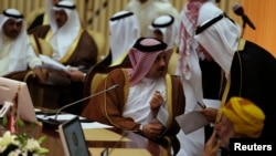 Qatar's Foreign Minister Khalid bin Mohamed Al-Attiyah (L) attends Gulf Cooperation Council (GCC) meeting in Riyadh June 2, 2014. 