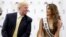 FILE - Donald Trump (L) and 2014 Miss Universe, Gabriela Isler, of Venezuela, talk during a news conference Oct. 2, 2014, in Doral, Florida.