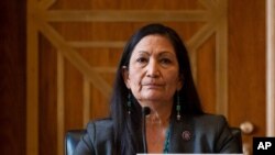FILE - Rep. Deb Haaland, D-N.M., listens during the Senate Committee on Energy and Natural Resources hearing on her nomination to be Interior secretary, on Capitol Hill, Feb. 23, 2021.