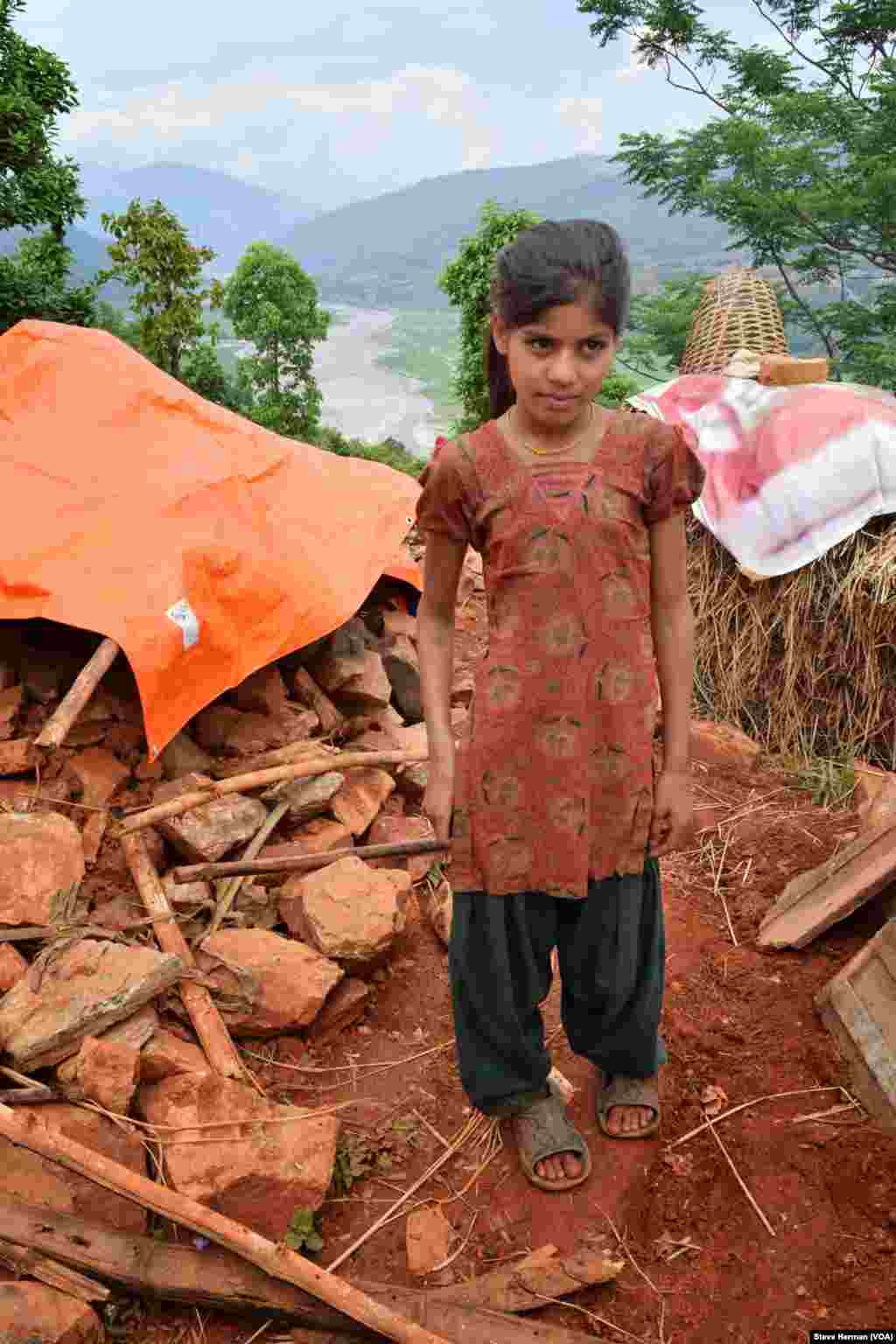 This girl's family was the only one in Ratomatey hamlet, which was flattened by last Saturday's magnitude-7.8 earthquake, to have received a tarp for shelter.