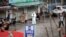 A worker in a protective suit is seen at the closed seafood market in Wuhan, Hubei province, China, Jan. 10, 2020. 