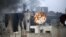 Smoke rises from a damaged building hit by pro-government forces as clashes continue with the Free Syrian Army, near the Old Town of Aleppo, November 2, 2012.