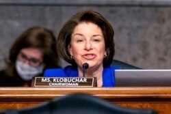 FILE - Sen. Amy Klobuchar, D-Minn., speaks at the start of a joint hearing of the Senate Homeland Security and Rules committees on Capitol Hill, Washington, Feb. 23, 2021.