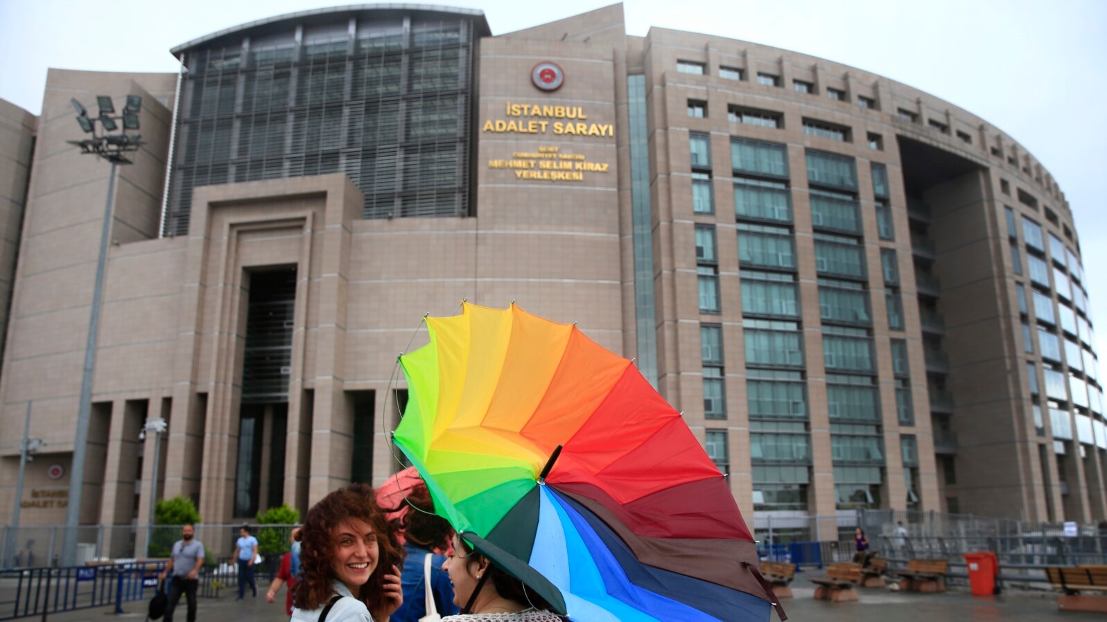 People walk outside Istanbul's court, July 17, 2017. 
