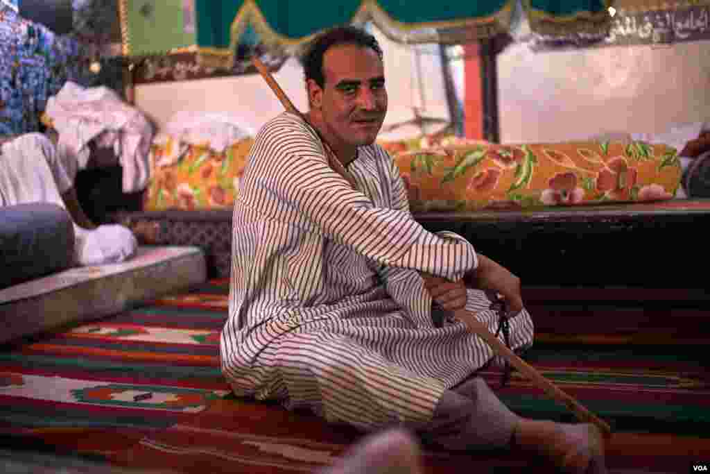 Ali Thabet, who came from Qena, he says, “I know many people who used to attend the Mulid in the past years, but they couldn’t attend this year because of their financial status, everything is so expensive now.” (H. Elrasam/VOA)