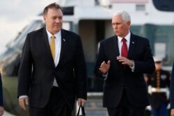 FILE - Vice President Mike Pence and Secretary of State Mike Pompeo arrive at Andrews Air Force Base, Md., Oct. 16, 2019.