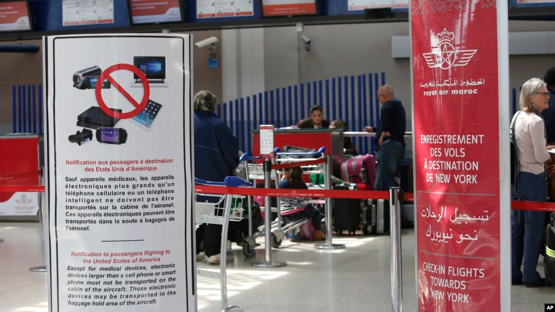 Signs list prohibited carry-on items at the entrance to a Casablanca-New York flight checkpoint at Casablanca Mohammed V International Airport, in Casablanca, Morocco, March 29, 2017.