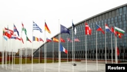 Flags of NATO member countries are seen at the Alliance headquarters in Brussels, Belgium, Nov. 26, 2019. 