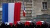 Police officers carry the coffins of the four victims of last week&#39;s knife attack during a ceremony in the courtyard of the Paris police headquarters. France&#39;s presidency said the victims will be posthumously given the country&#39;s highest award, the Legion of Honor.