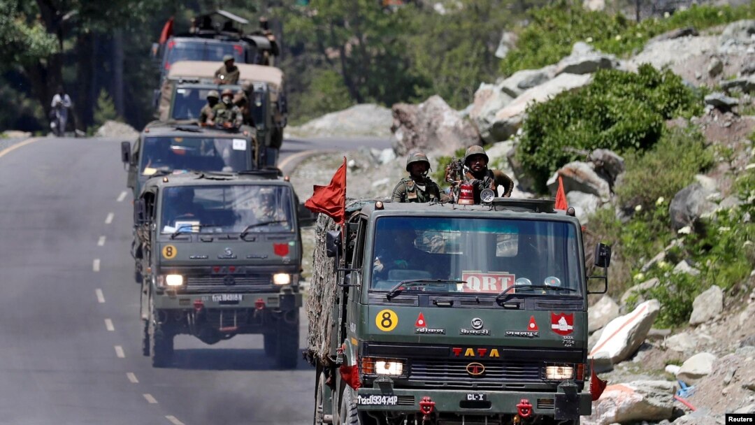 An Indian Army convoy moves along a highway leading to Ladakh, at Gagangeer in Kashmir's Ganderbal district, June 18, 2020.