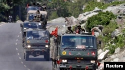 An Indian Army convoy moves along a highway leading to Ladakh, at Gagangeer in Kashmir's Ganderbal district, June 18, 2020.