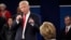 Republican presidential nominee Donald Trump points at Democratic presidential nominee Hillary Clinton as he speaks during the second presidential debate at Washington University in St. Louis, Oct. 9, 2016.