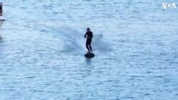 Surfer Rides Electric Board on Bilbao River to Promote Eco-Friendly Mobility