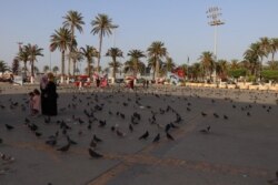 Anti-war posters hang in Martyr’s Square in Tripoli, Libya, July 10, 2019. (Heather Murdock/VOA)