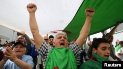 FILE - A man gestures during an anti-government protest in Algiers, Algeria, May 31, 2019. 