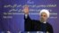In this photo released by official website of the office of the Iranian Presidency, President Hassan Rouhani waves to media after casting his vote for parliamentary and Experts Assembly elections in Tehran, Iran Friday, Feb. 26, 2016.