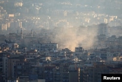 Smoke lingers in Beirut's southern suburbs after Israel strikes the area, Oct. 5, 2024.