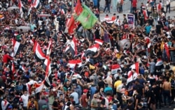 Demonstrators take part in a protest over corruption, lack of jobs and poor services, in Baghdad, Iraq, Oct, 26, 2019.