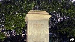FILE - The pedestal where the statue of Admiral Raphael Semmes stands empty, June 5, 2020 in Mobile, Alabama. The city of Mobile removed the Confederate statue without making any public announcements. 
