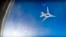In this frame grab from video provided by Russian Defence Ministry press service, Russian long range bomber Tu-22M3 flies during an air strike over Aleppo region of Syria on Aug. 16, 2016. 