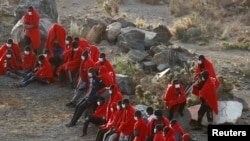 FILE - A group of immigrants is pictured at Las Carpinteras beach on the island of Gran Canaria, Spain, May 26, 2020. 