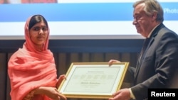 Malala Yousafzai attends a ceremony with United Nations Secretary-General Antonio Guterres after being selected a United Nations messenger of peace in New York, New York, April 10, 2017. 