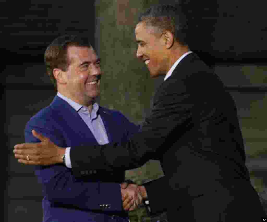 President Barack Obama, right, shakes hands with Russian Prime Minister Dmitry Medvedev on arrival for the G8 Summit Friday, May 18, 2012 at Camp David, Md. (AP Photo/Charles Dharapak)