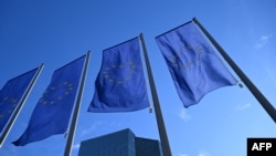 FILE - Flags of the European Union flutter in front of the headquarters of the European Central Bank in Germany on Jan. 30, 2025.