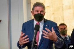 FILE - Sen. Joe Manchin, D-WVa., speaks to the media after senate democrats luncheon, on Capitol Hill in Washington, Jan. 13, 2022.