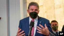 FILE - Sen. Joe Manchin, D-WVa., speaks to the media after senate democrats luncheon, on Capitol Hill in Washington, Jan. 13, 2022. 