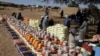 The World Food Program and World Relief distribute emergency food in Kulbus, West Darfur, Sudan, in late March 2024. The United Nations said on April 5, 2024, it has begun distributing food in Sudan’s war-ravaged Darfur province for the first time in months.