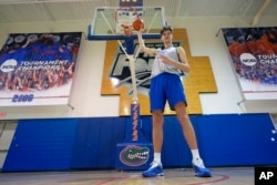 Olivier Rioux poses for a photo after practice, Friday, Oct. 18, 2024, in Gainesville, Fla. (AP Photo/John Raoux)