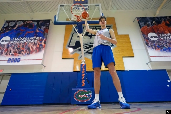 Olivier Rioux poses for a photo after practice, Friday, Oct. 18, 2024, in Gainesville, Fla. (AP Photo/John Raoux)