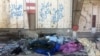 These bodies of IS militants were recently laid out in the street for pick-up under pro-Iraqi military graffiti on March 1, 2018 in Old Mosul, Iraq.
