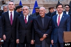 NATO Secretary General Jens Stoltenberg, Afghan opposition presidential candidate Abdullah Abdullah, Afghan President Ashraf Ghani, and U.S. Secretary of Defense Mark Esper pose for a photo at the presidential palace in Kabul, Feb. 29, 2020.