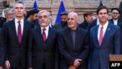 From left, NATO Secretary General Jens Stoltenberg, Afghan opposition presidential candidate Abdullah Abdullah, Afghan President Ashraf Ghani, and U.S. Secretary of Defense Mark Esper pose for a photo at the presidential palace in Kabul, Feb. 29, 2020. 
