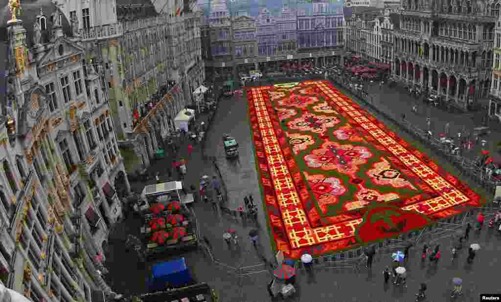 A giant flower carpet is seen at Brussels' Grand Place, Belgium. This year's theme for the flower carpet is Turkey and around 750,000 begonias were used to create the 1,800 square meter flower carpet design, according to the event organizers.