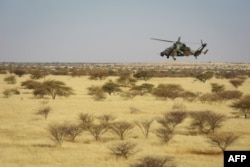 FILE - A Tigre helicopter of France's Barkhane mission in central Mali, is seen as the G5 Sahel anti-jihadist force began operations Nov. 1, 2017.