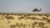 FILE - A Tigre helicopter of France's Barkhane mission in central Mali is seen as the G5 Sahel anti-jihadist force began operations Nov. 1, 2017.