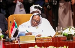 FILE - Foreign Minister of Sudan Asma Mohamed Abdalla attends a meeting of foreign ministers of Arab and African countries of the Red Sea and the Gulf of Aden, in Riyadh, Saudi Arabia, Jan. 6, 2020.