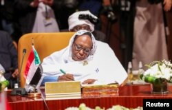 FILE - Foreign Minister of Sudan Asma Mohamed Abdalla attends a meeting of foreign ministers of Arab and African countries of the Red Sea and the Gulf of Aden, in Riyadh, Saudi Arabia, Jan. 6, 2020.