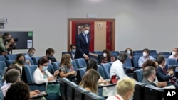 In this photo taken and provided by the Spanish Government on Aug. 25, 2020, Spain's Prime Minister Pedro Sanchez arrives to give a news conference at the Moncloa Palace in Madrid, Spain.