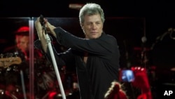 FILE - Bon Jovi performs with his band in Miami Beach, Florida. 