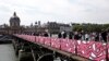Romantic Street Art Replaces Love Locks on Paris Bridge